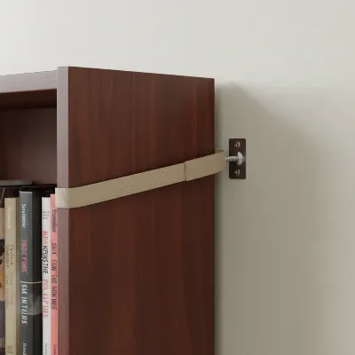 An anti-tip strap securing a heavy bookshelf to a wall stud