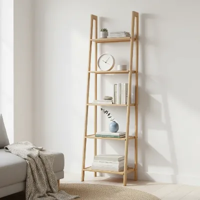 A narrow, tall ladder-style bookshelf made of light-colored bamboo, filled with a mix of books and small decorative items, set against a white wall in a modern, small living room.